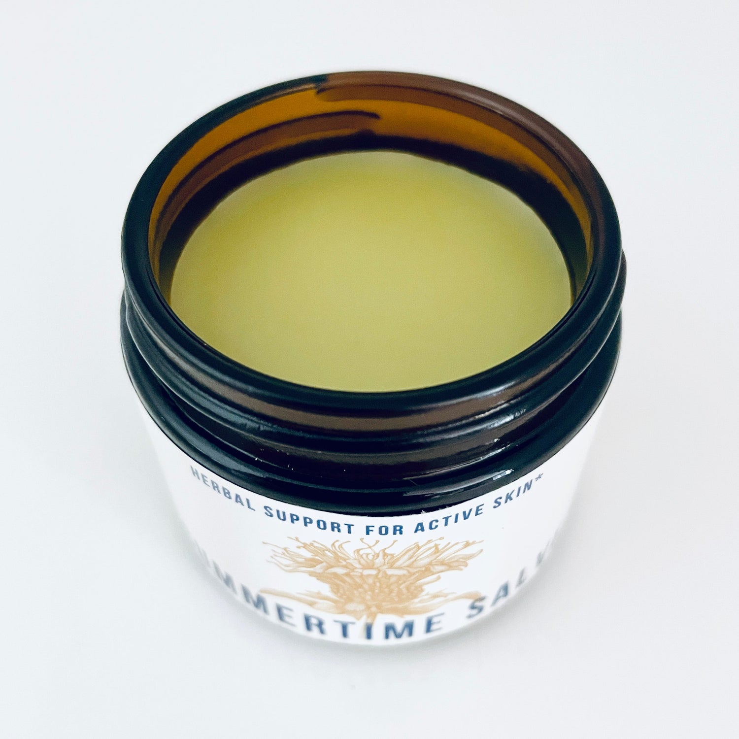 A jar of herbal topical salve